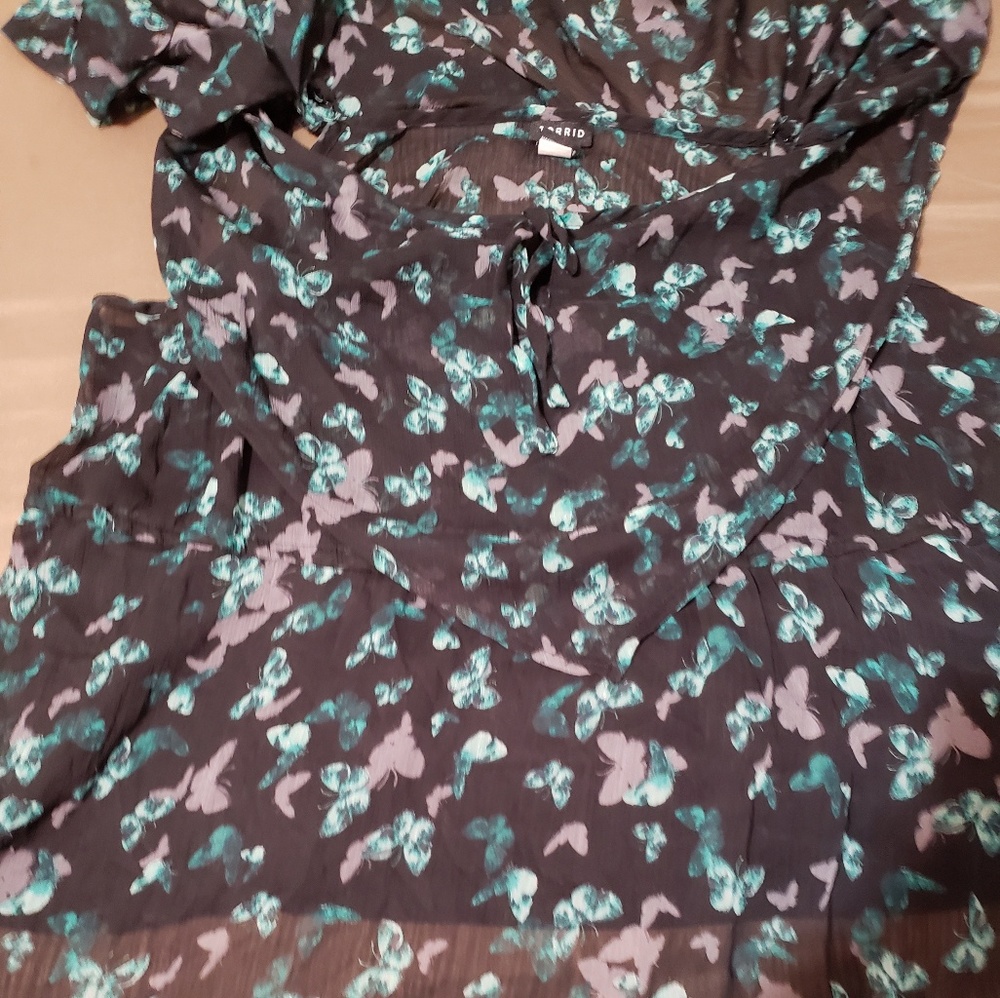 Billowy Torrid top has shoulder cutout and straps